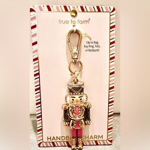 New Nutcracker Keychain Holder. True to Form. Pink/Blk enamel. Gold tone.